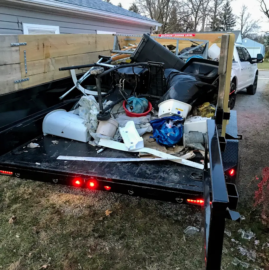 Roll-off dumpster delivered to a residential driveway in Ames
